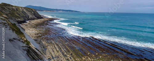 atlantic ocean coast with accented rocky strips and lines