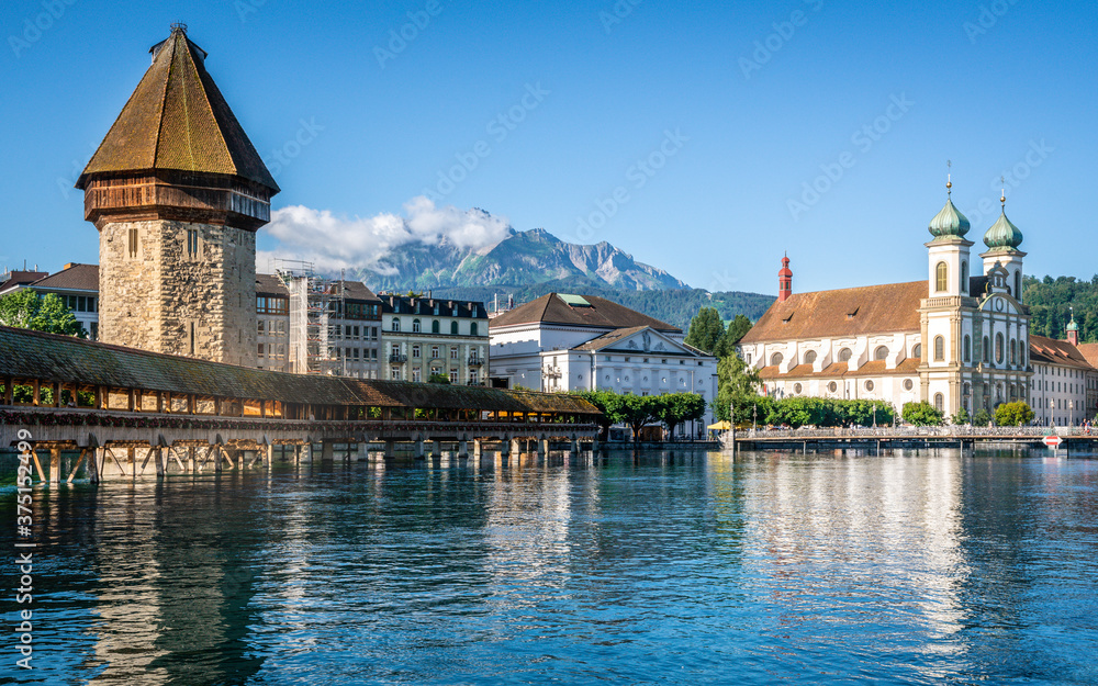 Scenic view of Lucerne old town with the Chapel bridge Pilatus mount and Jesuit church Lucerne Switzerland