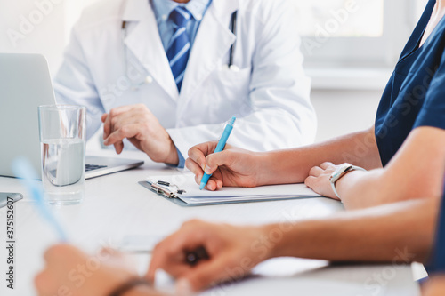 Cropped image of medical professional meeting in hospital office