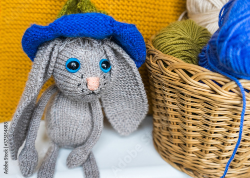 hand made knitted sad hare. rabbit amigurumi. knitted toys