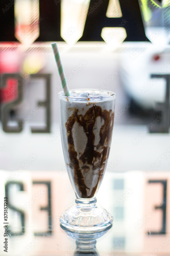 Milkshake with chocolate sauce in a restaurant Milkshake with chocolate sauce in a restaurant