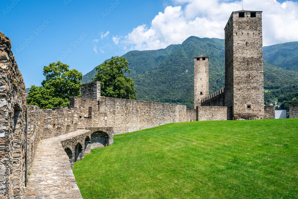 Scenic view of Castelgrande castle with the two black and white towers and wall walk in Bellinzona Switzerland
