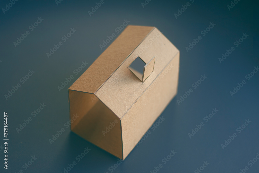Paper house on a dark background
Paper house on a dark background