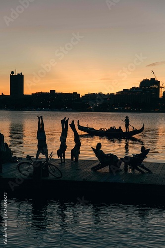 People at sunset on a dock