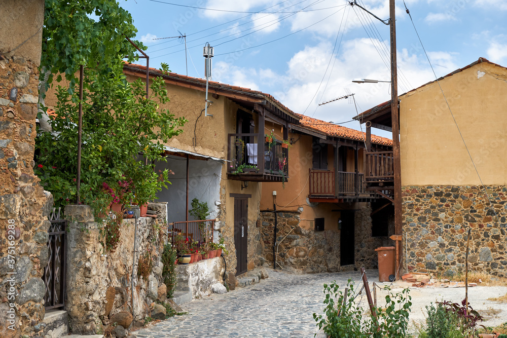 Fototapeta premium The narrow mediaeval street of old Kakopetria. Nicosia District. Cyprus