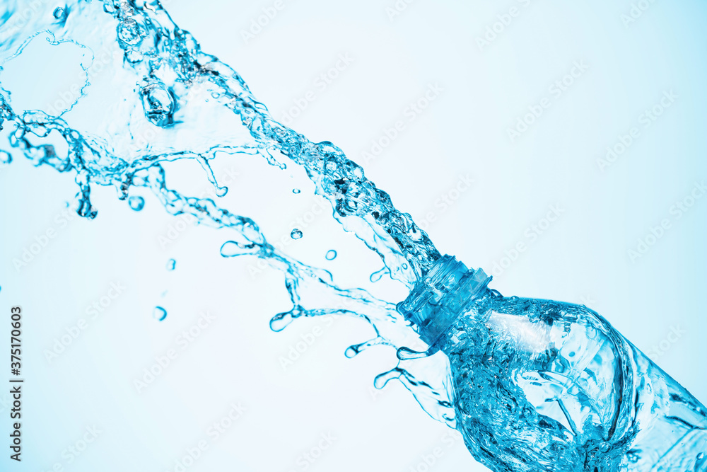Water is poured out of a plastic bottle. Water is poured out of a plastic bottle.