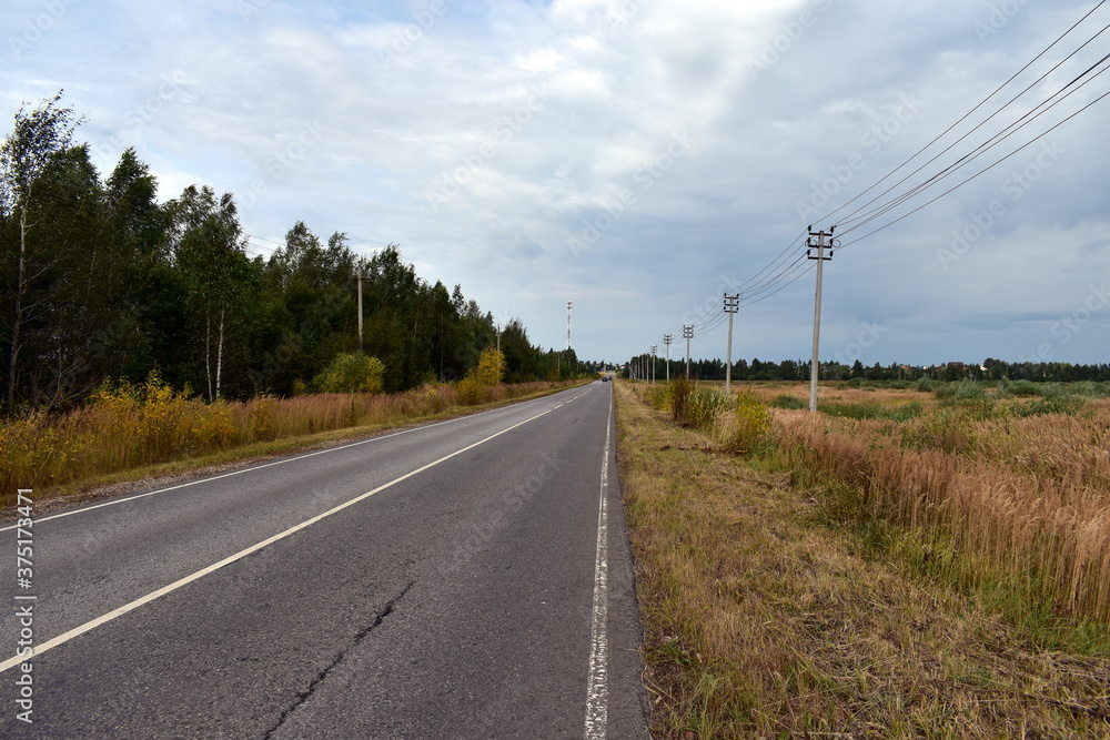 the cloudy highway goes into the distance