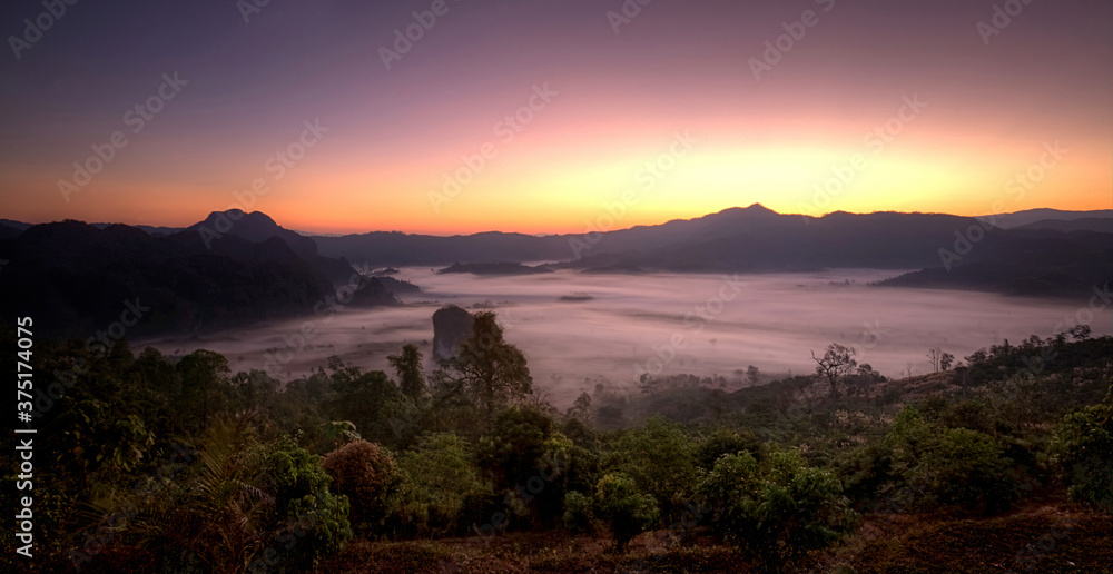 sunrise over the mountains with morning fog