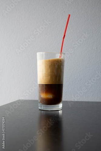 iced coffee with a red straw