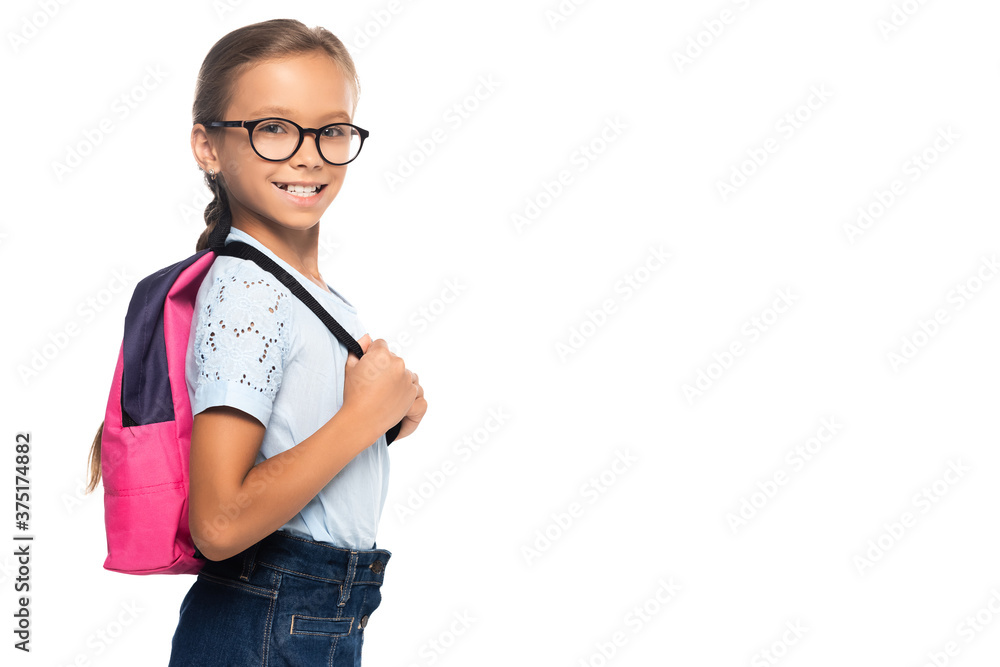 schoolgirl in glasses looking at camera and touching backpack isolated on white schoolgirl in glasses looking at camera and touching backpack isolated on white