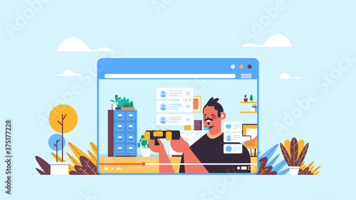 male blogger recording game process online blog live streaming blogging concept guy in web browser window playing video games living room interior horizontal portrait vector illustration