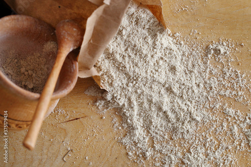 Almond flour pile from top on wooden background