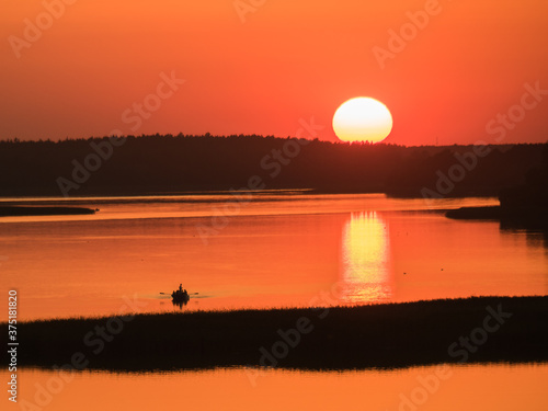 sunset over the Lake Rajgród photo