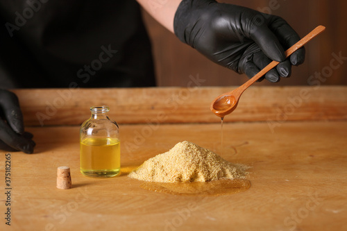 Simple condiment Mustard with seeds cup and mustard flour. photo