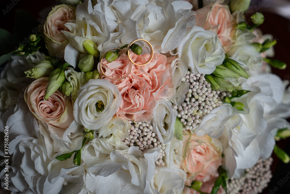 Romantic decorations, white light flowers for the holiday, wedding rings for the bride Romantic decorations, white light flowers for the holiday, wedding rings for the bride