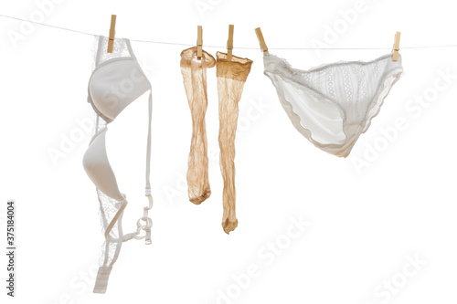 Underwear - bra, stockings and pants on clothline photo