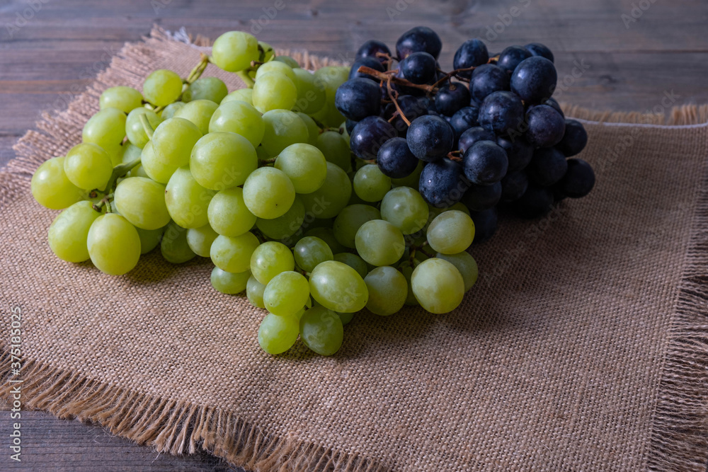 harvested ripe juicy green and black grapes harvested ripe juicy green and black grapes
