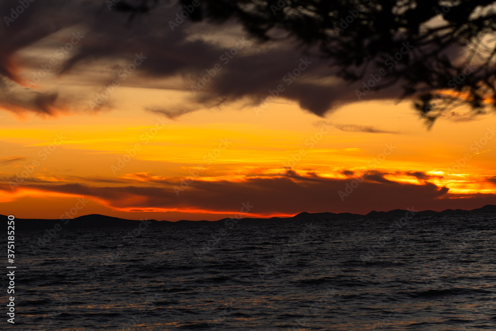 Colorful sunset at the Adriatic sea photographed in August 2020 in Zadar, Croatia