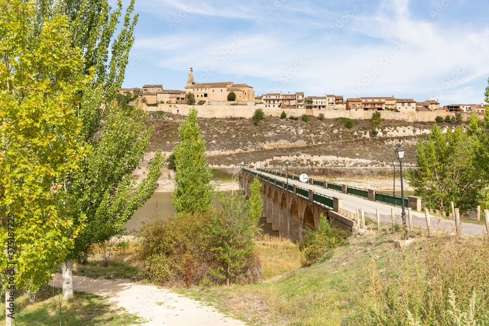 a view of Maderuelo medieval village and the bridge over Riaza river (Linares reservoir), province of Segovia, Castile and Leon, Spain