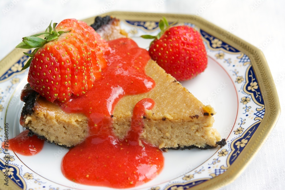 Vegan Cheesecake with a Chocolate Bottom and Strawberry Coulis Vegan Cheesecake with a Chocolate Bottom and Strawberry Coulis