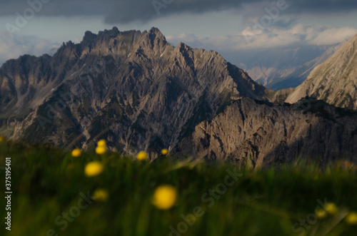 sunset in the mountains steep cliffs hiking adventure morning mood high mountains photo