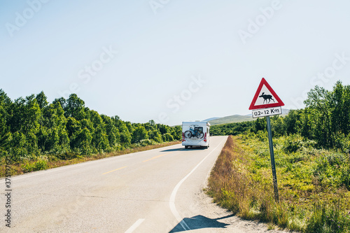 Caravan on Highway with a Moose Warning Sign in Norway, Scandinavia photo
