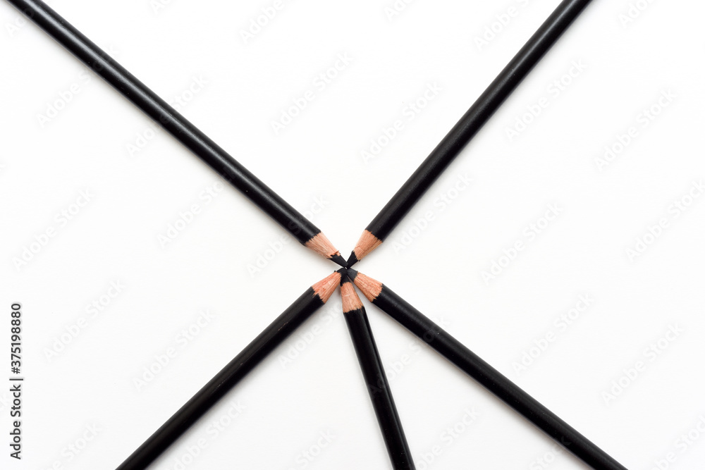 simple concept of creativity with overhead shot of black pencils on paper simple concept of creativity with overhead shot of black pencils on paper
