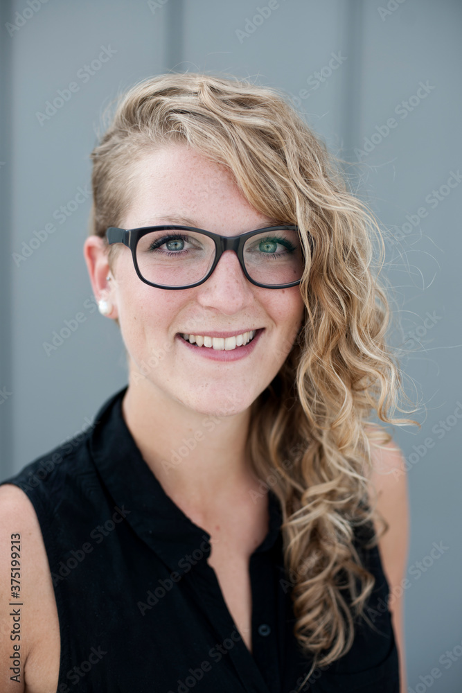 People: Portrait of a young beautiful woman with black glasses People: Portrait of a young beautiful woman with black glasses