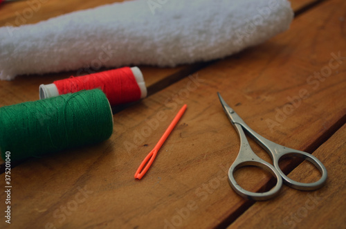 Threads, scissors, knitting needles, hook. Everything for handmade.