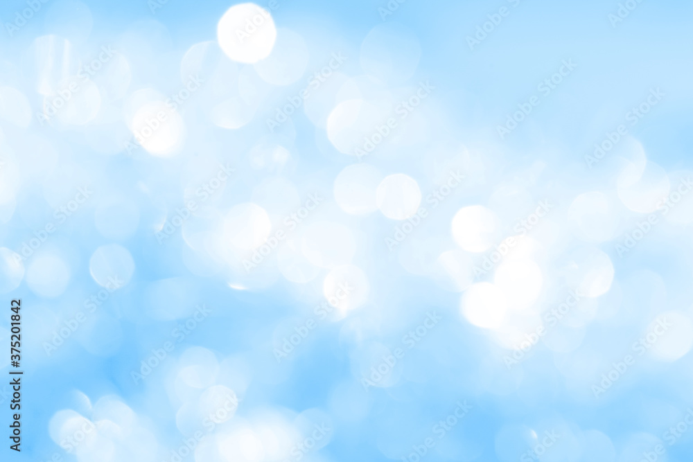 Bokeh light on blue background, sky with circle glitter light blue. Snow abstract soft glowing with vivid bright light and bokeh blur effect. Bokeh light on blue background, sky with circle glitter light blue. Snow abstract soft glowing with vivid bright light and bokeh blur effect.