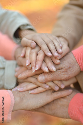 Cropped image, family putting hands together close up  © aletia2011