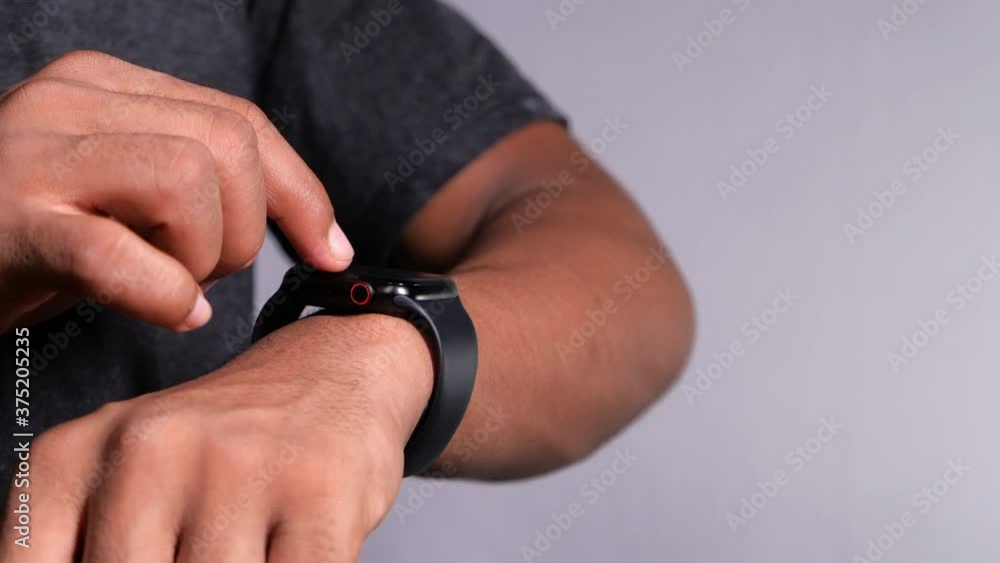 top view of man's hand using smart watch. top view of man's hand using smart watch.