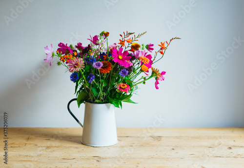 Flowers in a vase on a table photo