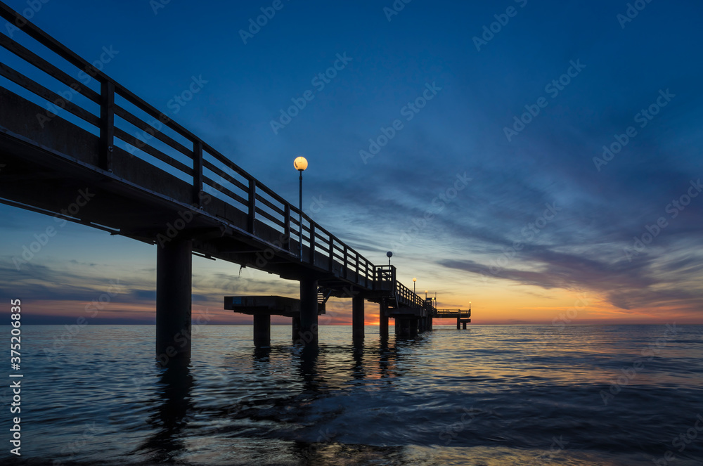 Fototapeta premium Pier on the baltic sea at sunset.