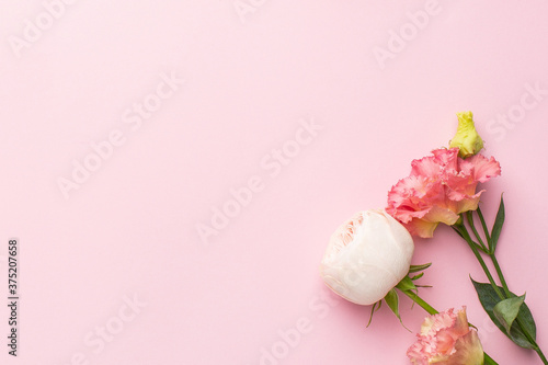 Pink and white flower bouquet on pastel background with copyspace © KatrinaEra