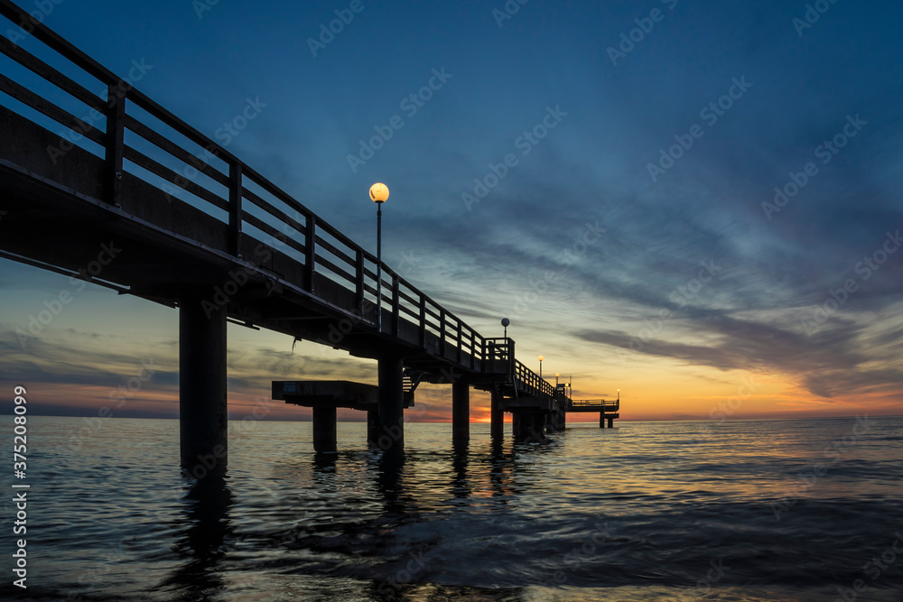 Pier on the baltic sea at sunset.