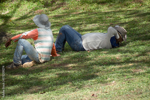 People resting in meadow