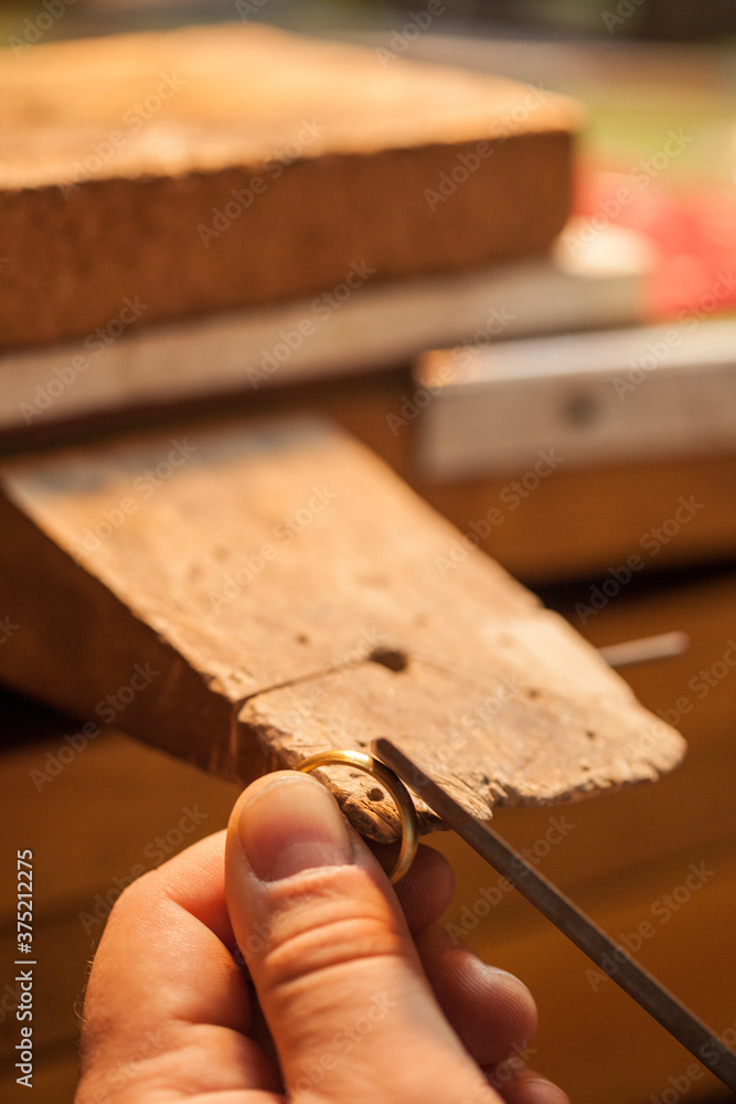 Goldsmith making a golden ring. Goldsmith making a golden ring.