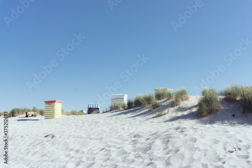 Beach huts along the North Sea photo