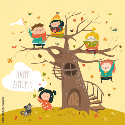Happy children sitting on tree in autumn park