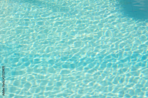 Blue water in swimming pool background 