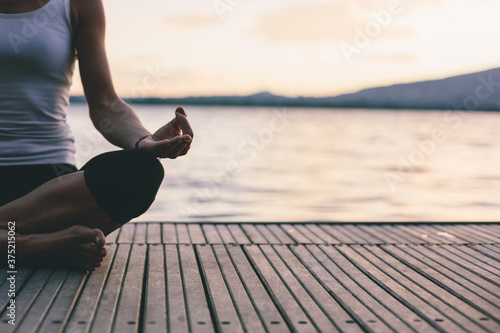 Woman doing yoga outdoors photo