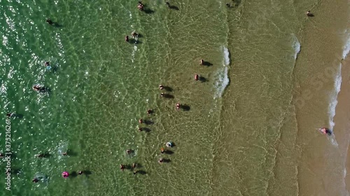 Beach with umbrellas in summer, drone shot