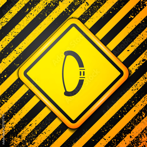 Black Medieval bow icon isolated on yellow background. Medieval weapon. Warning sign. Vector.