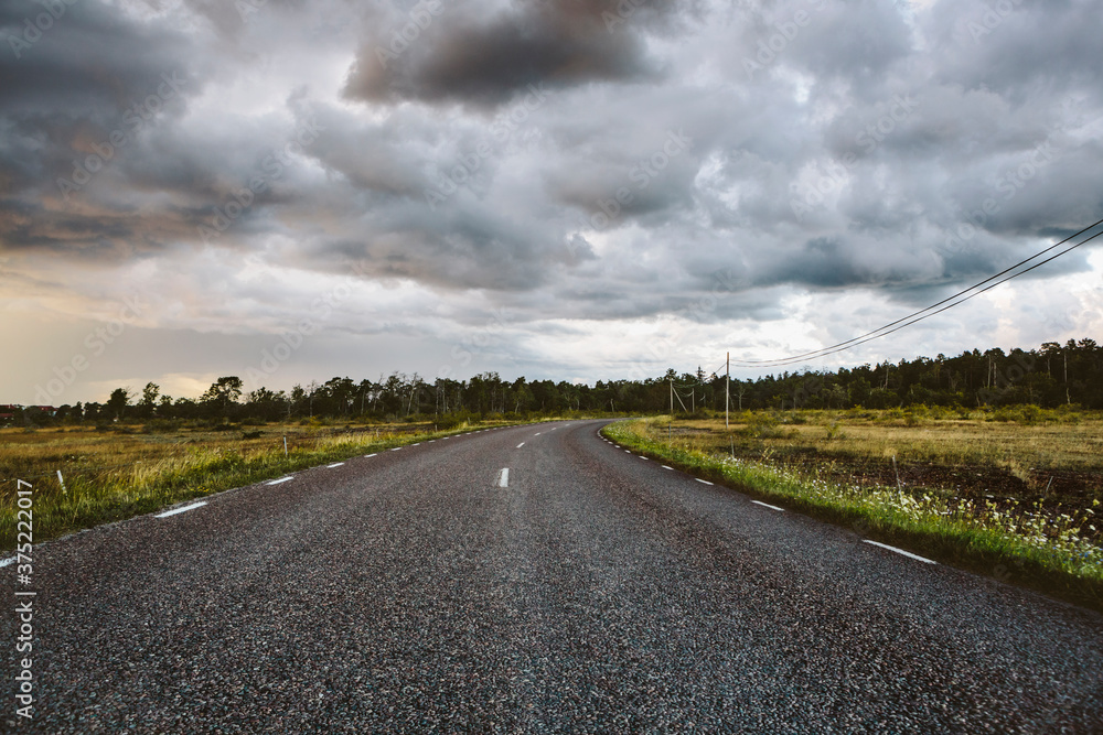 Storm clouds over empty country road Storm clouds over empty country road