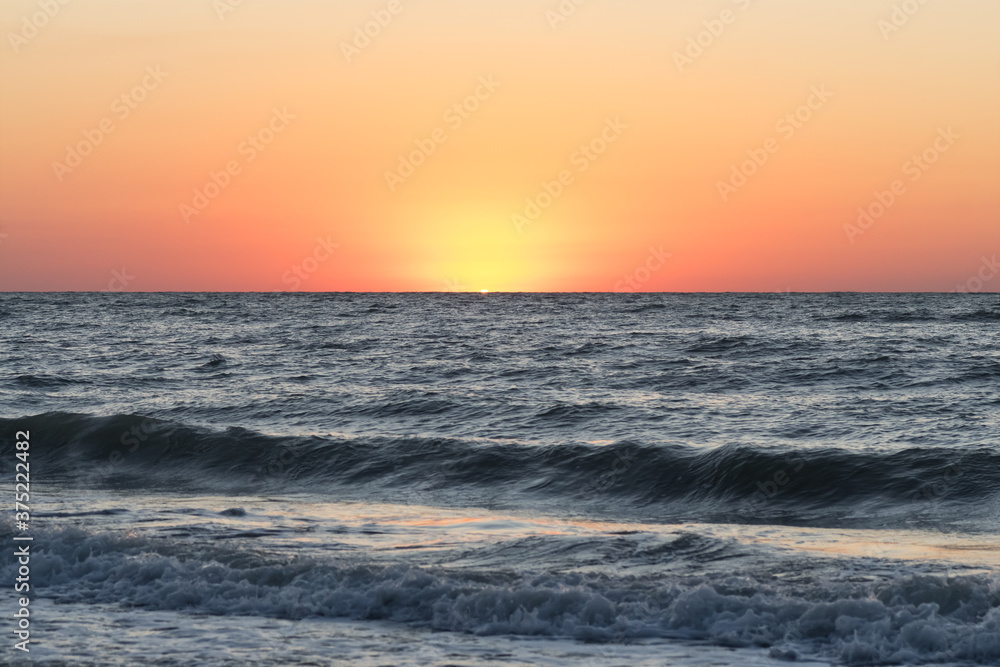 Fototapeta premium Beautiful seascape. Dawn at stormy sea. Image