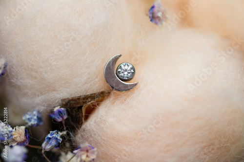 Beautiful piercing jewelry. Macro shot. Selective focus. photo