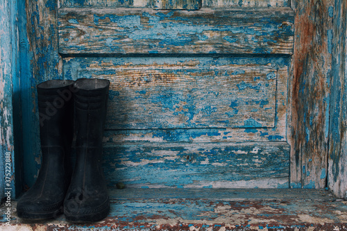 Rubber Welington boots on doorway photo