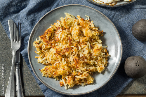 Tableau sur toile Homemade Fried Shredded Hashbrowns and Eggs