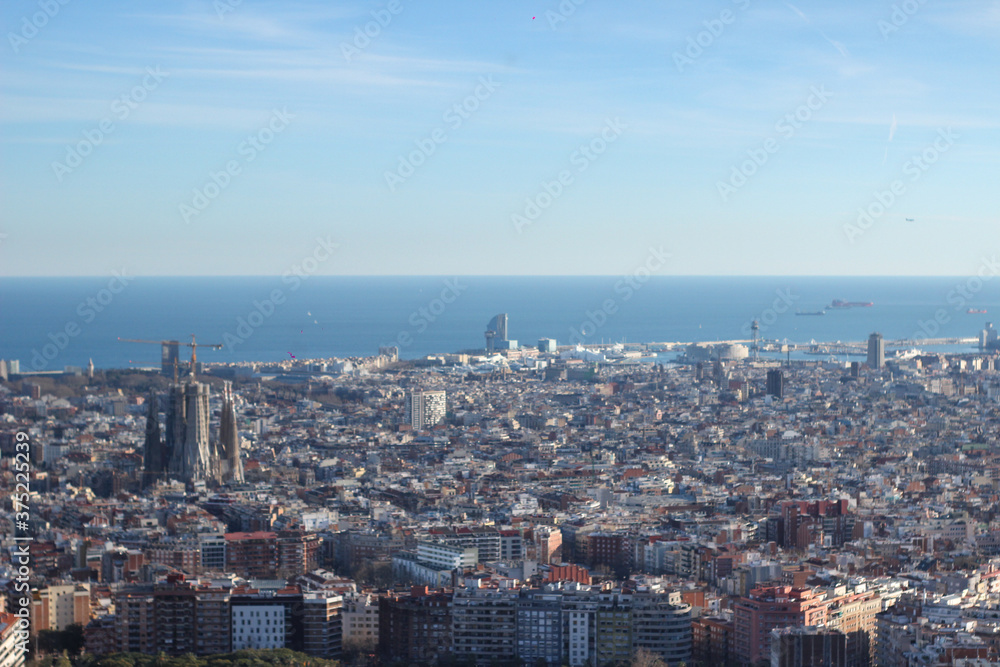 aerial view of the city of barcelona panoramla sun day